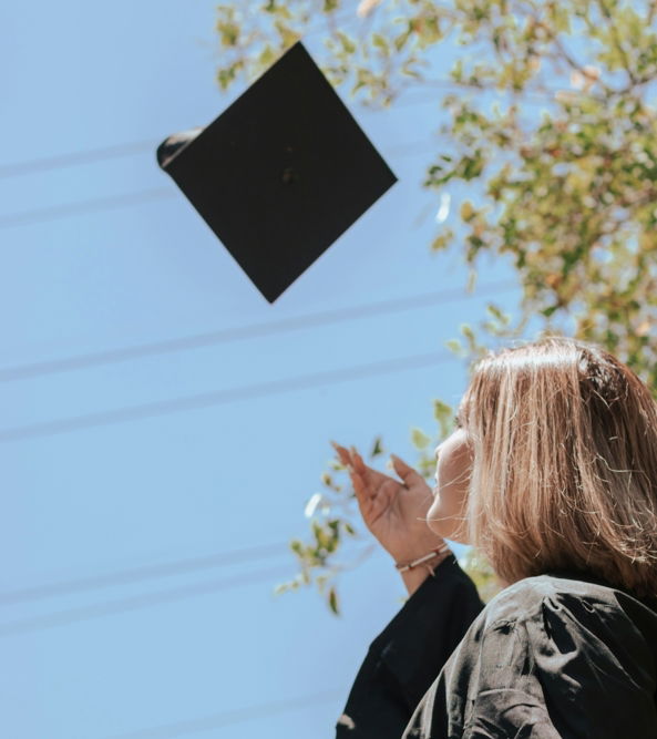 a person holding a black sign